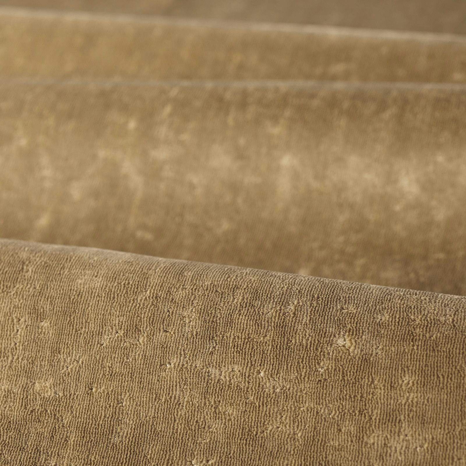 Warm antelope taupe woven upholstery fabric with fine ridges and pale flecks