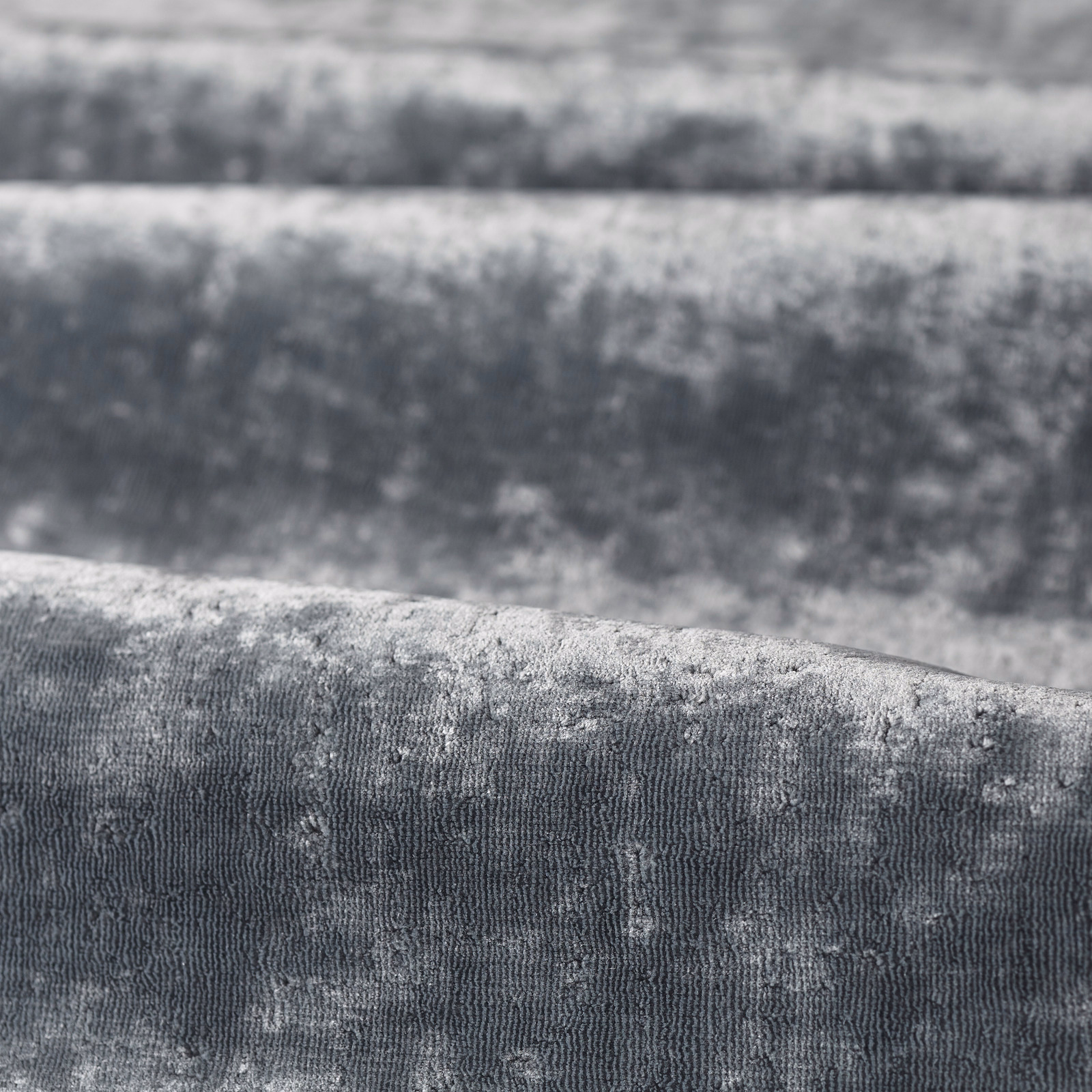 Close-up of muted Curzon Blue fabric with cloudy blue-grey texture and fine ribbed weave
