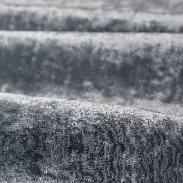 Close-up of muted Curzon Blue fabric with cloudy blue-grey texture and fine ribbed weave