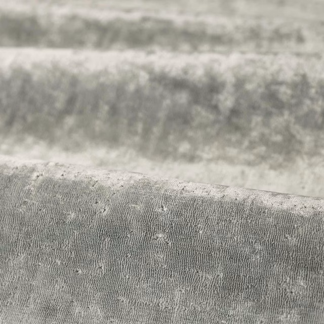 Close-up of cool Nimbus grey textile with fine ribbing and irregular flecked texture