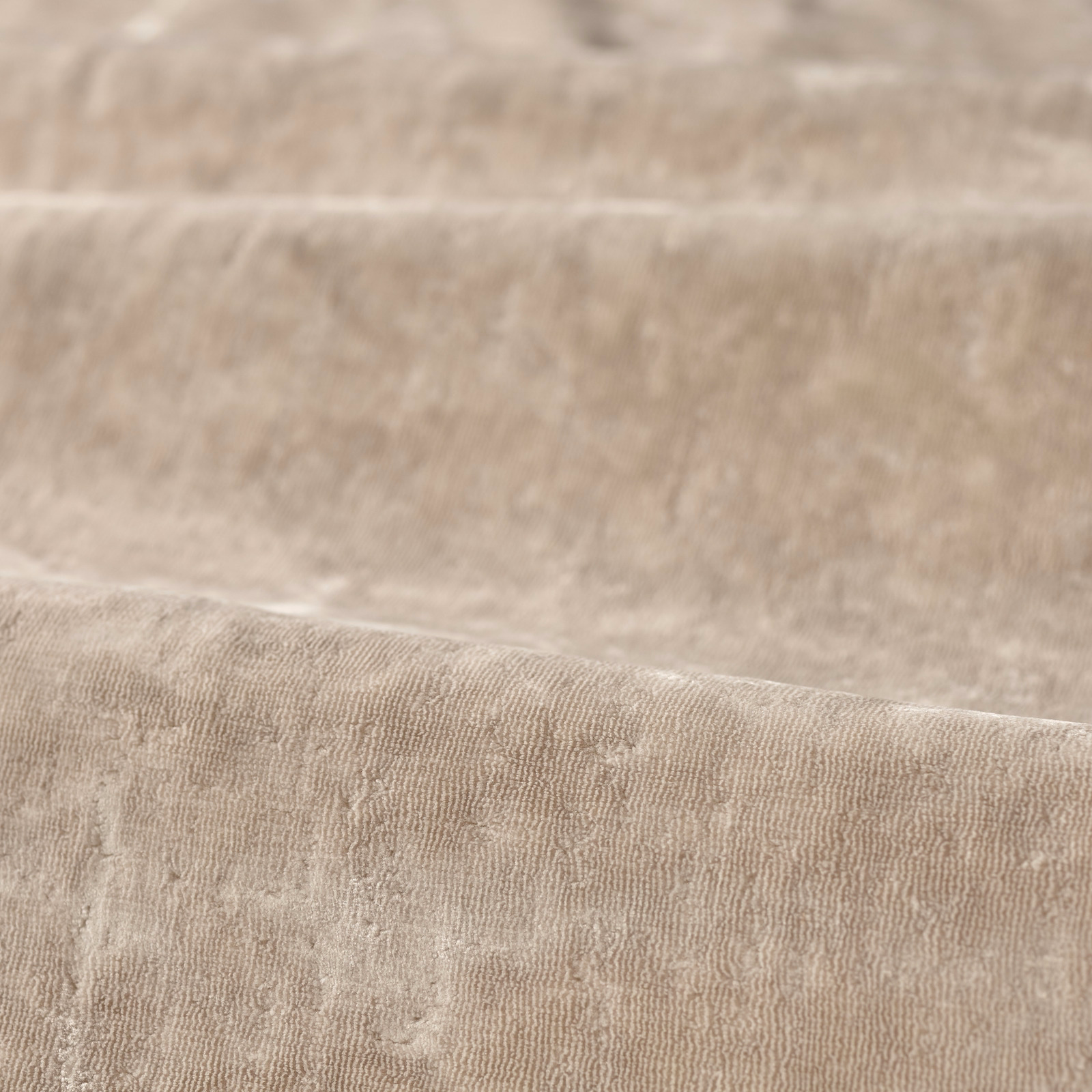 Blush-taupe plain fabric with fine rippled texture and soft directional sheen