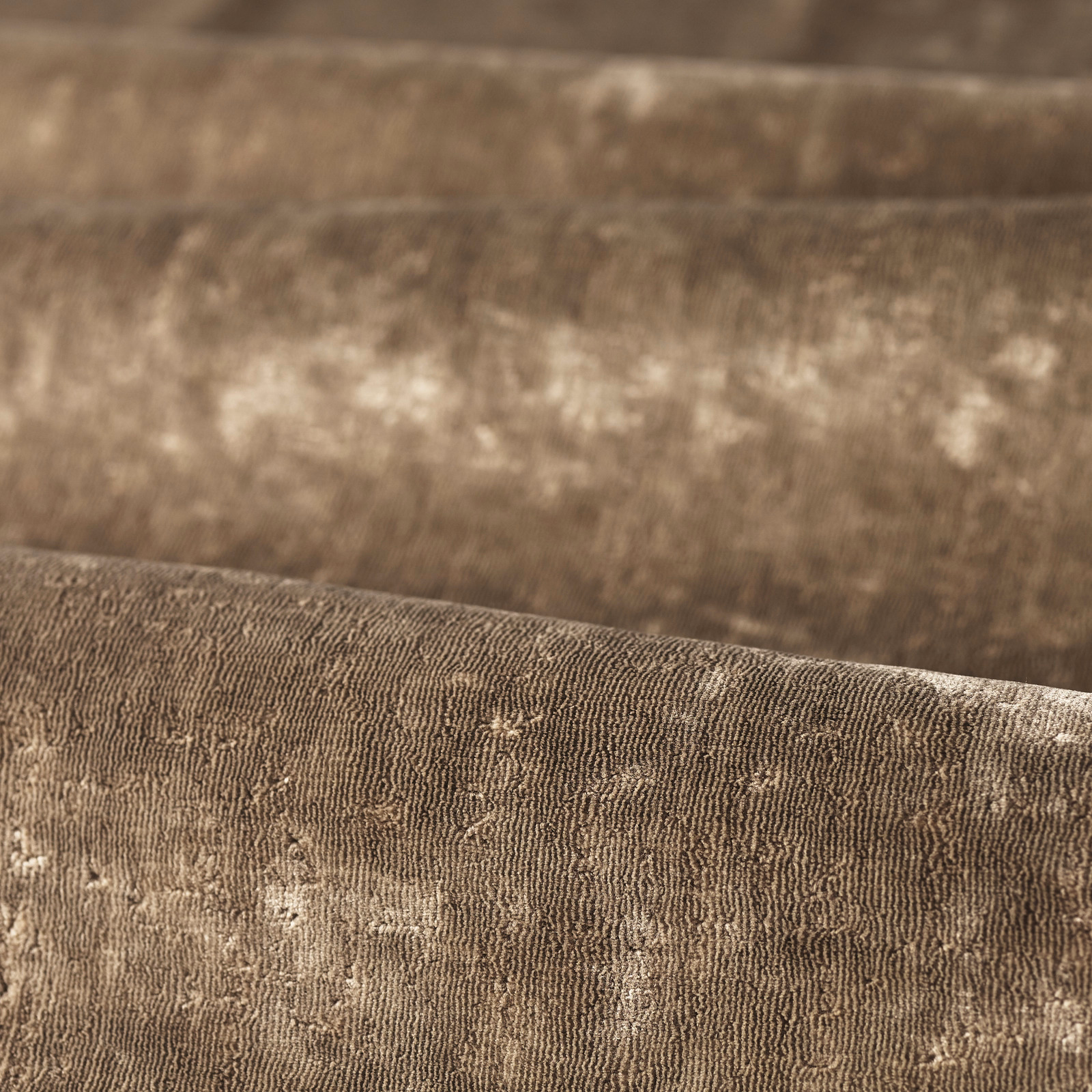 Warm sable taupe textile with fine vertical ridges and softly mottled pale flecks