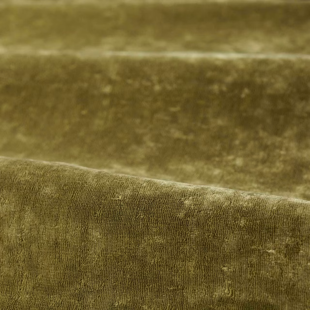Close-up of Spanish olive green plush pile with subtle tonal mottling