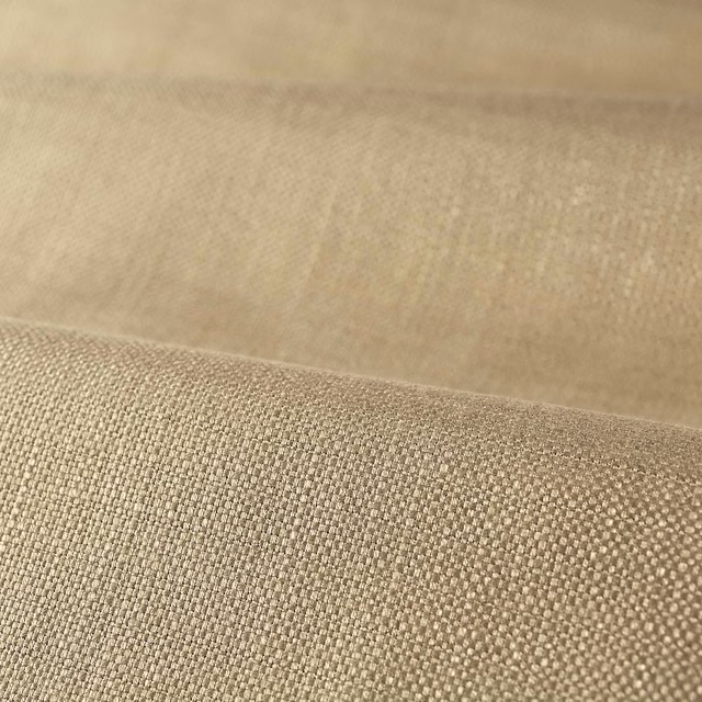Warm antique-beige plain weave showing fine texture and soft taupe tonal variation