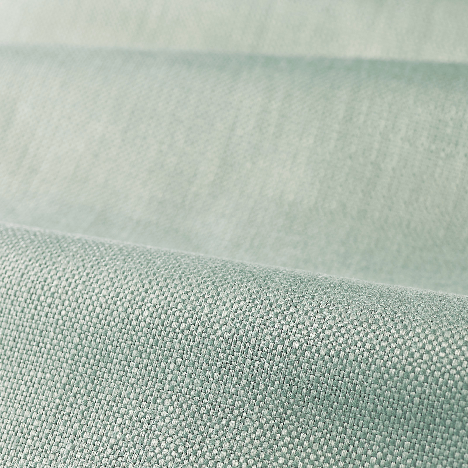 Close-up of pale aqua-green plain weave with a softly lustrous, finely textured surface