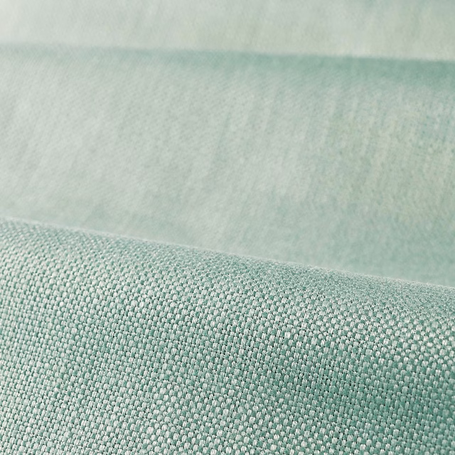 Close-up of pale aqua-green plain weave with a softly lustrous, finely textured surface