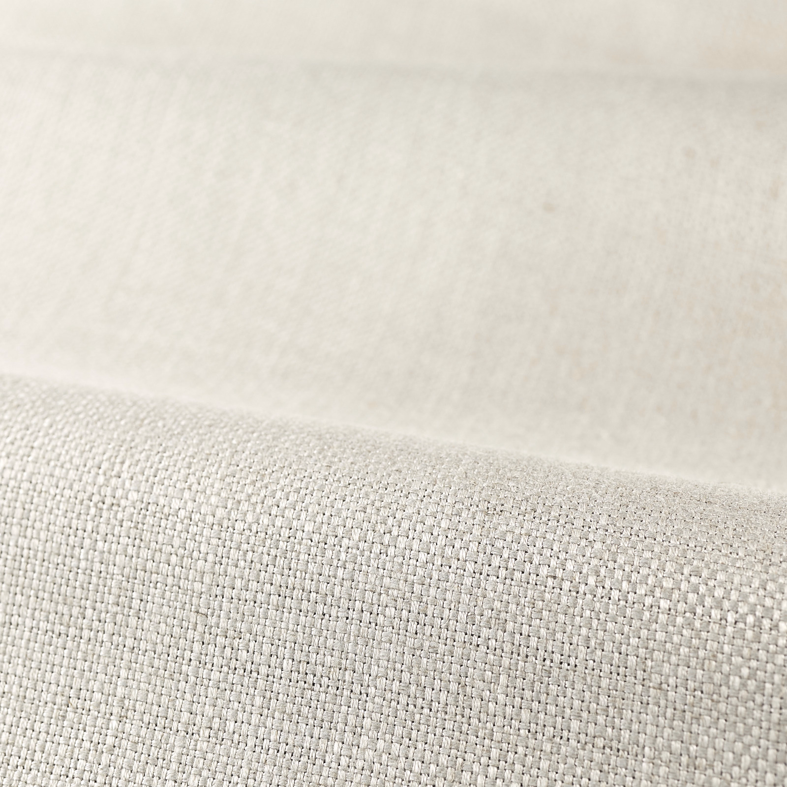 Close-up of pale platinum-grey plain weave with a softly reflective, even texture