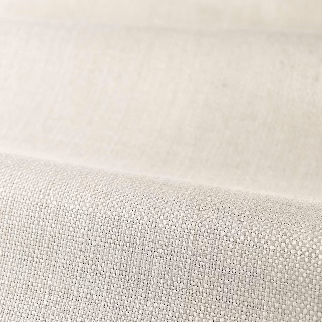 Close-up of pale platinum-grey plain weave with a softly reflective, even texture