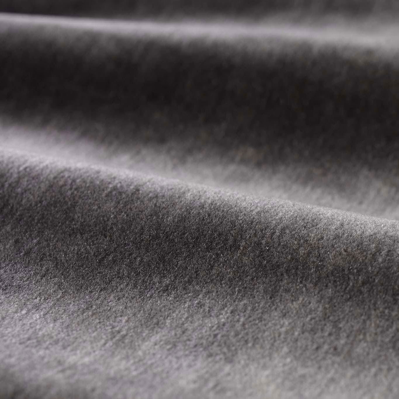 Deep anthracite-grey plush pile with soft directional sheen across folded swatch