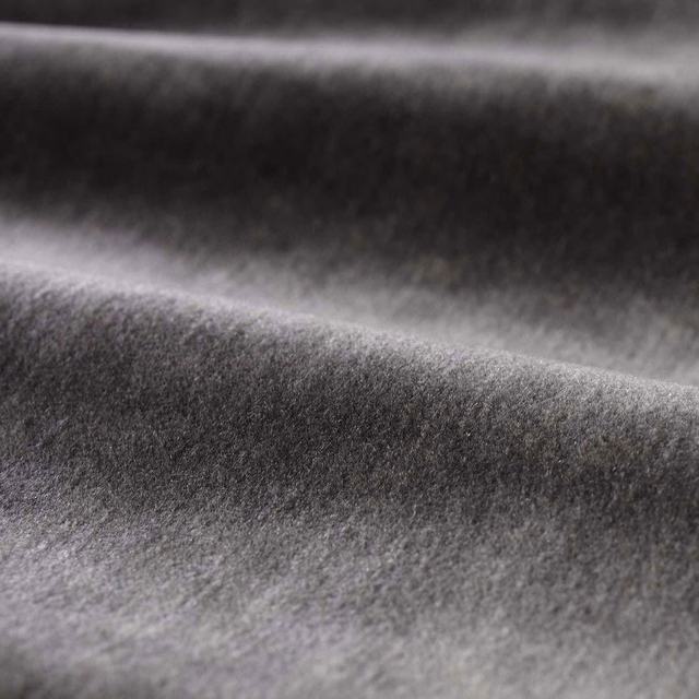 Deep anthracite-grey plush pile with soft directional sheen across folded swatch