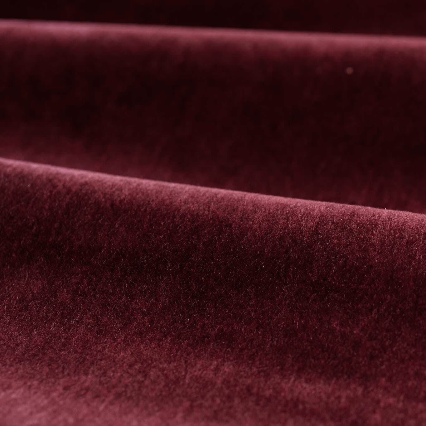 Deep Bordeaux velvet pile folded into dark wine and berry highlights