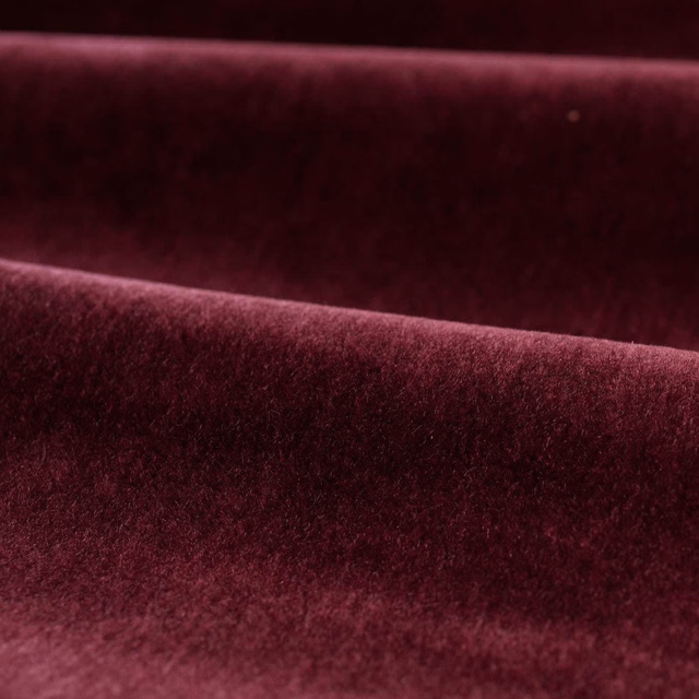 Deep Bordeaux velvet pile folded into dark wine and berry highlights
