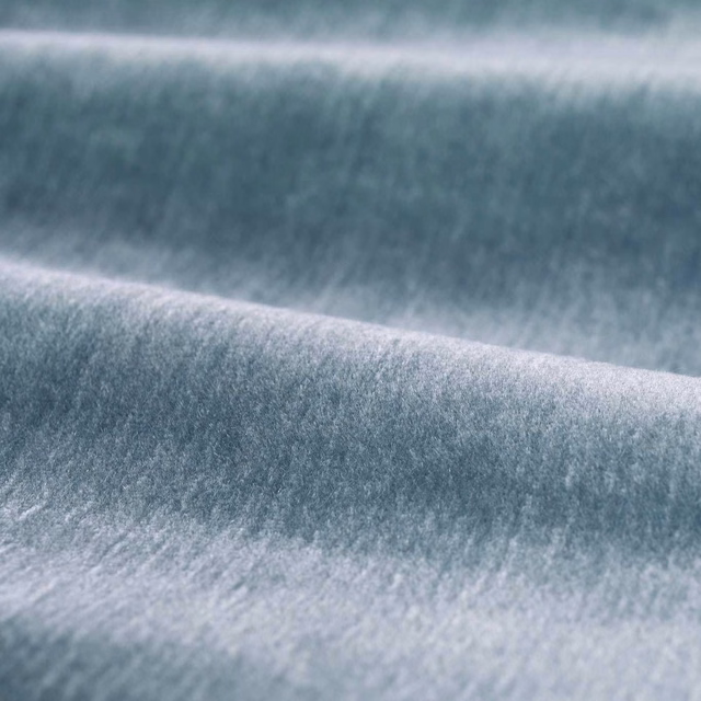 Close-up of cool blue-grey mohair with plush brushed pile and soft sheen