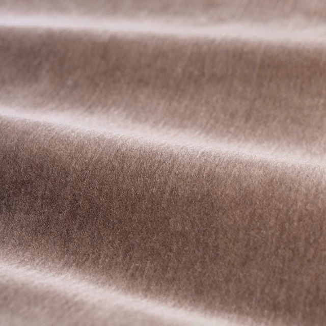 Warm mink-brown plush velvet folds showing soft directional sheen and dense pile