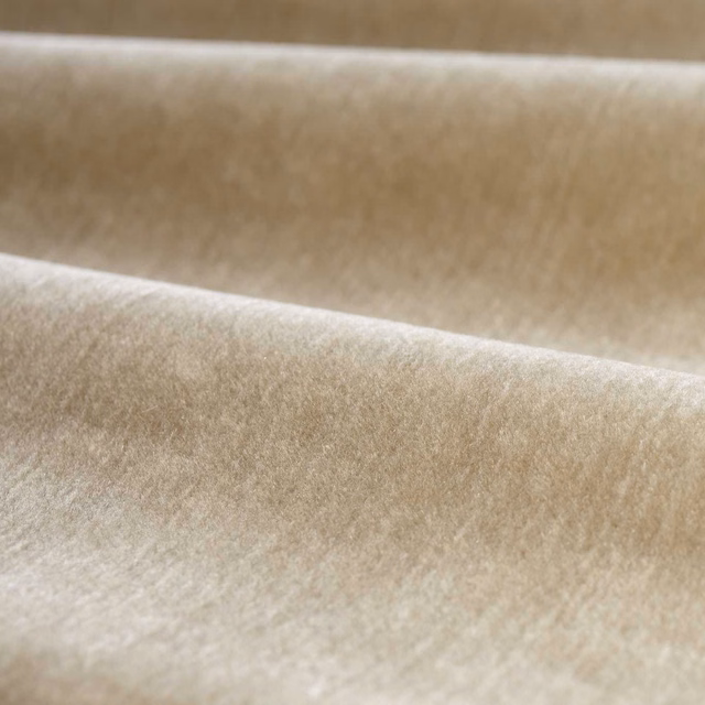 Warm taupe plush plain with pale highlights across its directional velvety nap