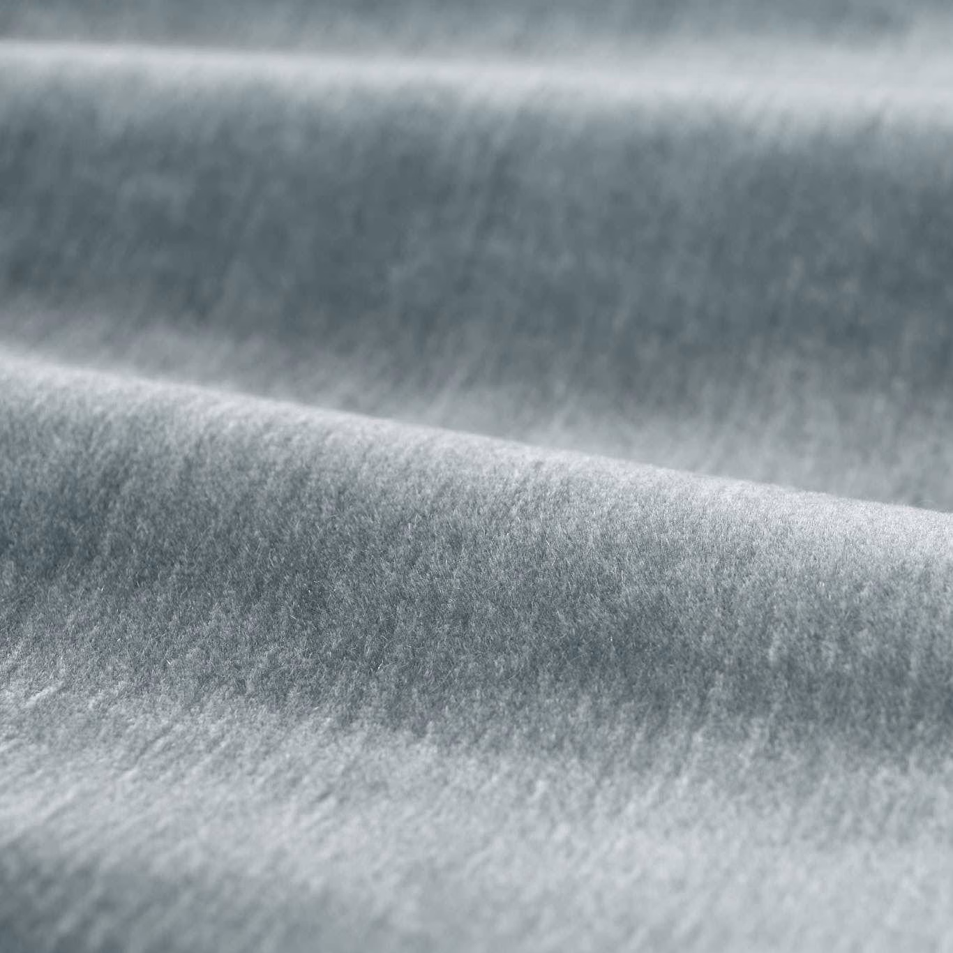 Cool silver-grey plain fabric with dense velvety pile and soft folded highlights
