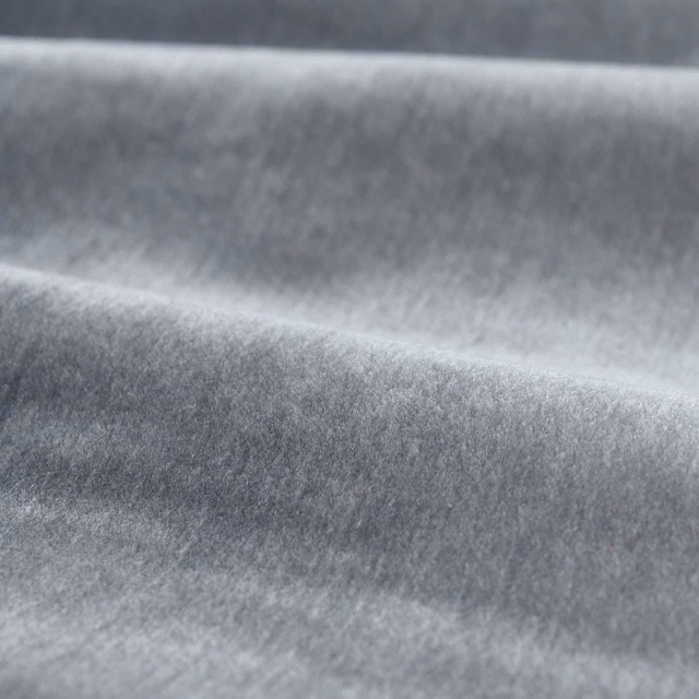 Cool silver-grey mohair pile with soft directional shading across folded fabric