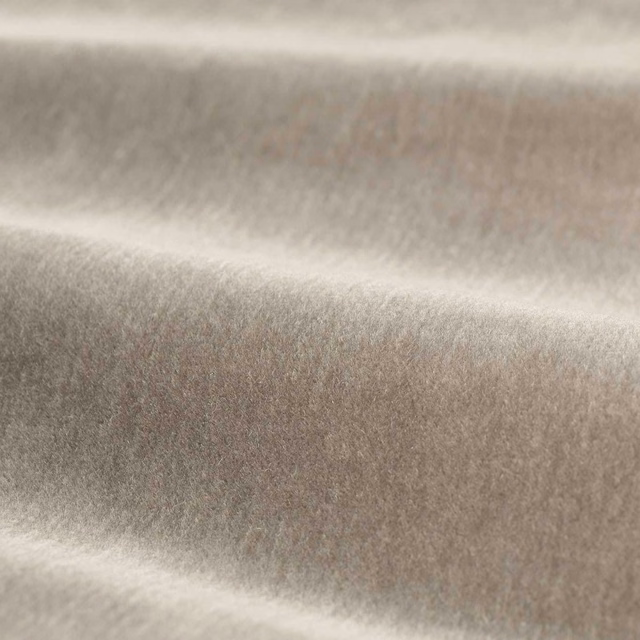 Smoky taupe-grey plush textile with soft directional sheen across folded velvet surface