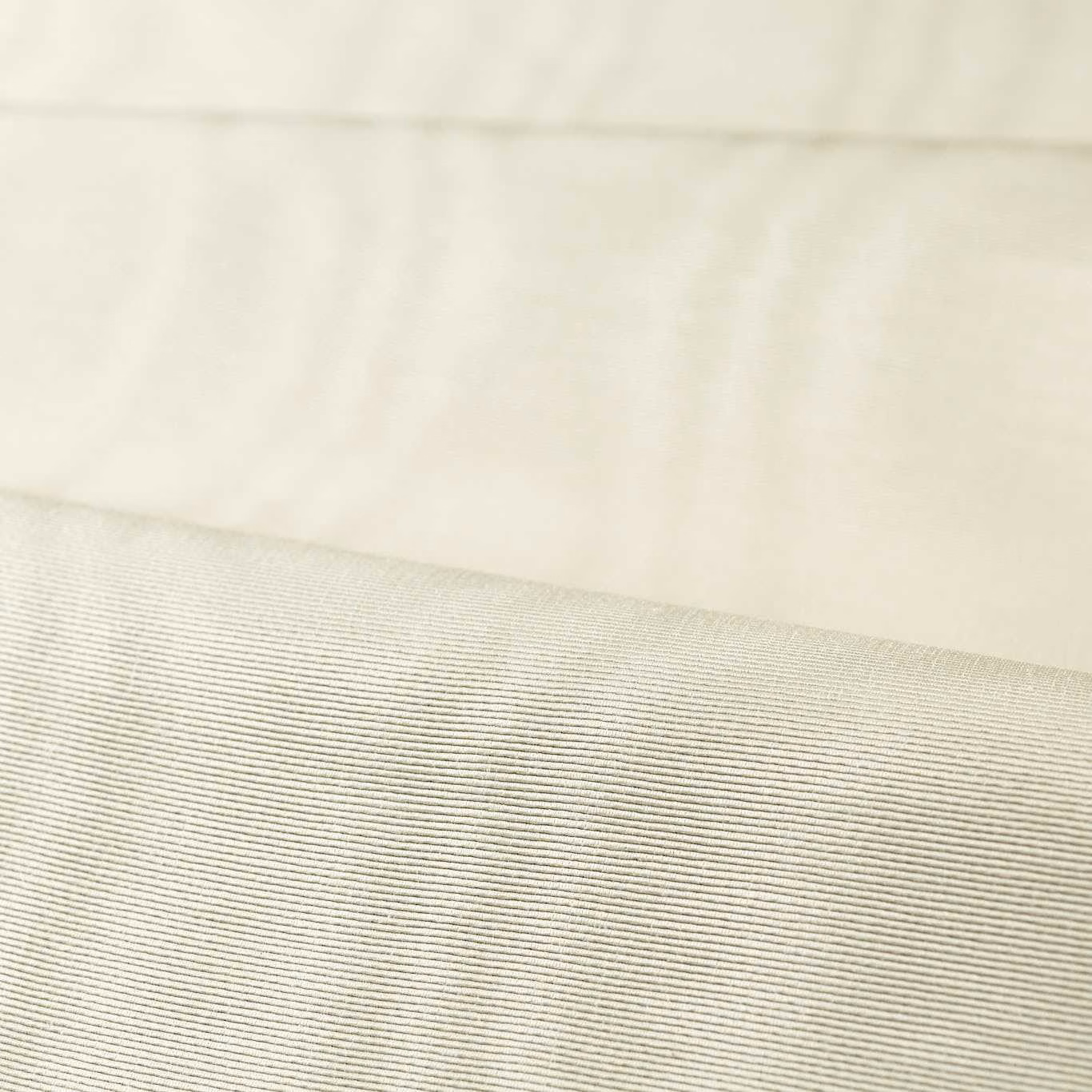 Pale chalk-ivory moiré fabric showing fine horizontal ribbing and softly shifting light