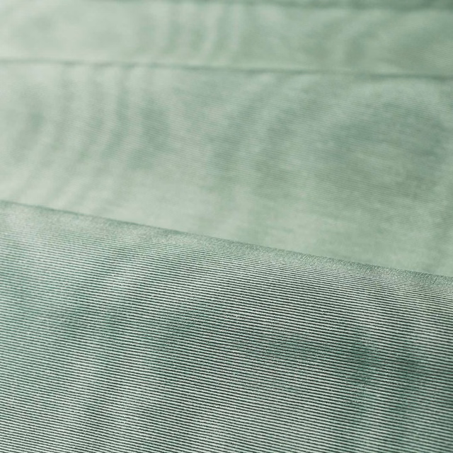 Pale duck egg blue-green moiré with fine horizontal ribbing across a folded swatch