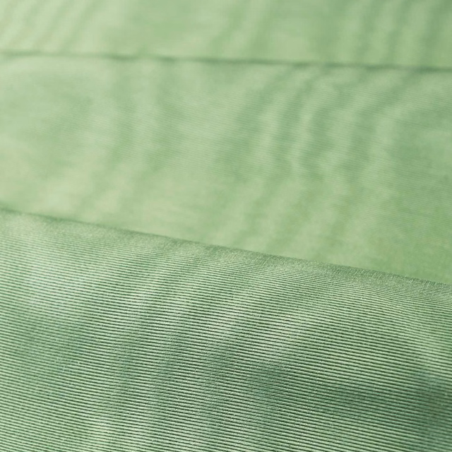 Pale jade green moiré textile with cloudy ripples and a fine ribbed weave