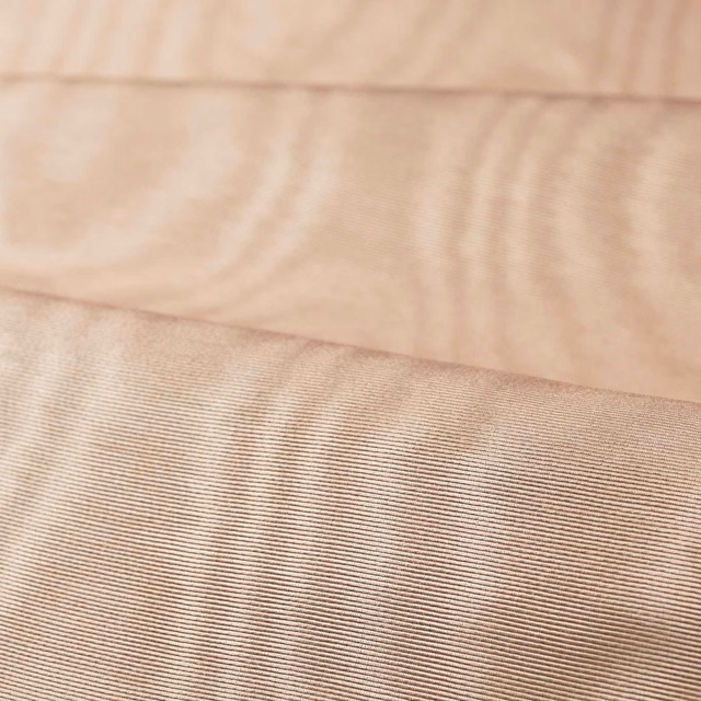 Pale rose quartz moiré fabric with fine horizontal ribbed texture and soft tonal waves