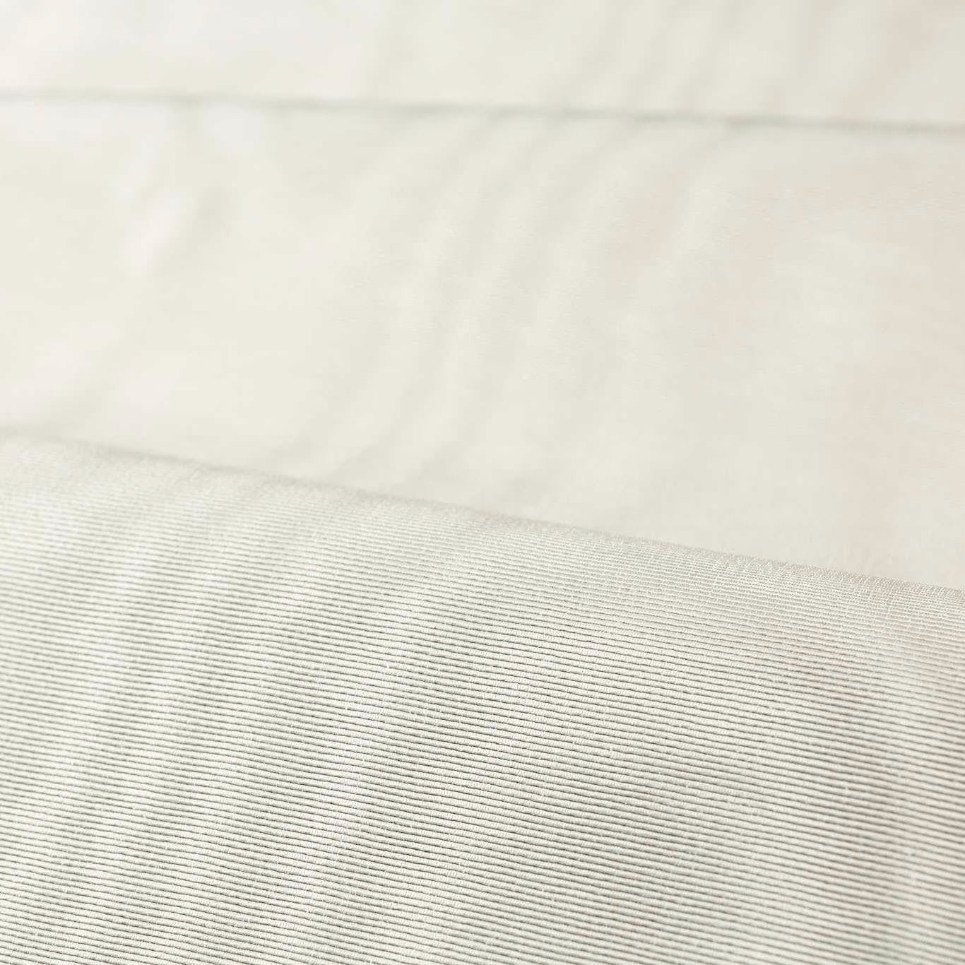 Close-up of pale silver-grey fabric with fine horizontal ribbing and soft sheen