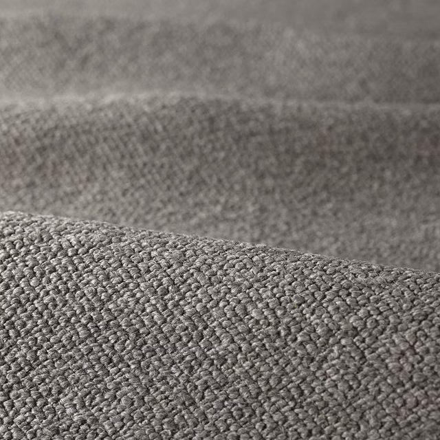 Close-up of cool grey bouclé fabric showing dense, raised looped texture