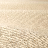 Warm stone beige boucle with dense rounded loops and softly shaded woven texture