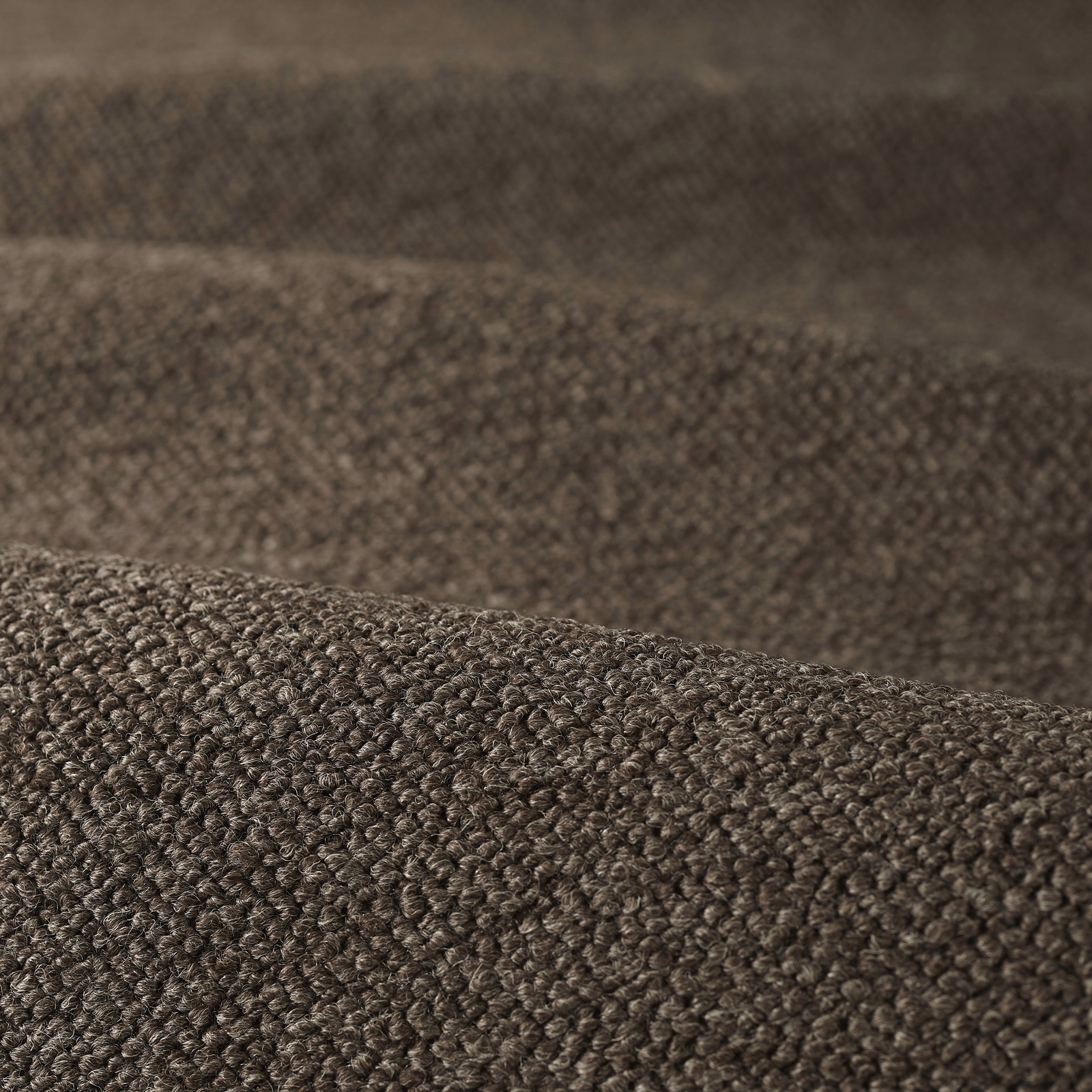 Close-up of deep tobacco-brown boucle with dense rounded loops and mottled texture
