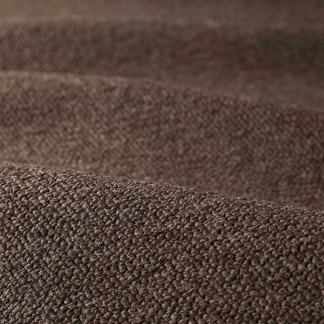 Close-up of deep tobacco-brown boucle with dense rounded loops and mottled texture