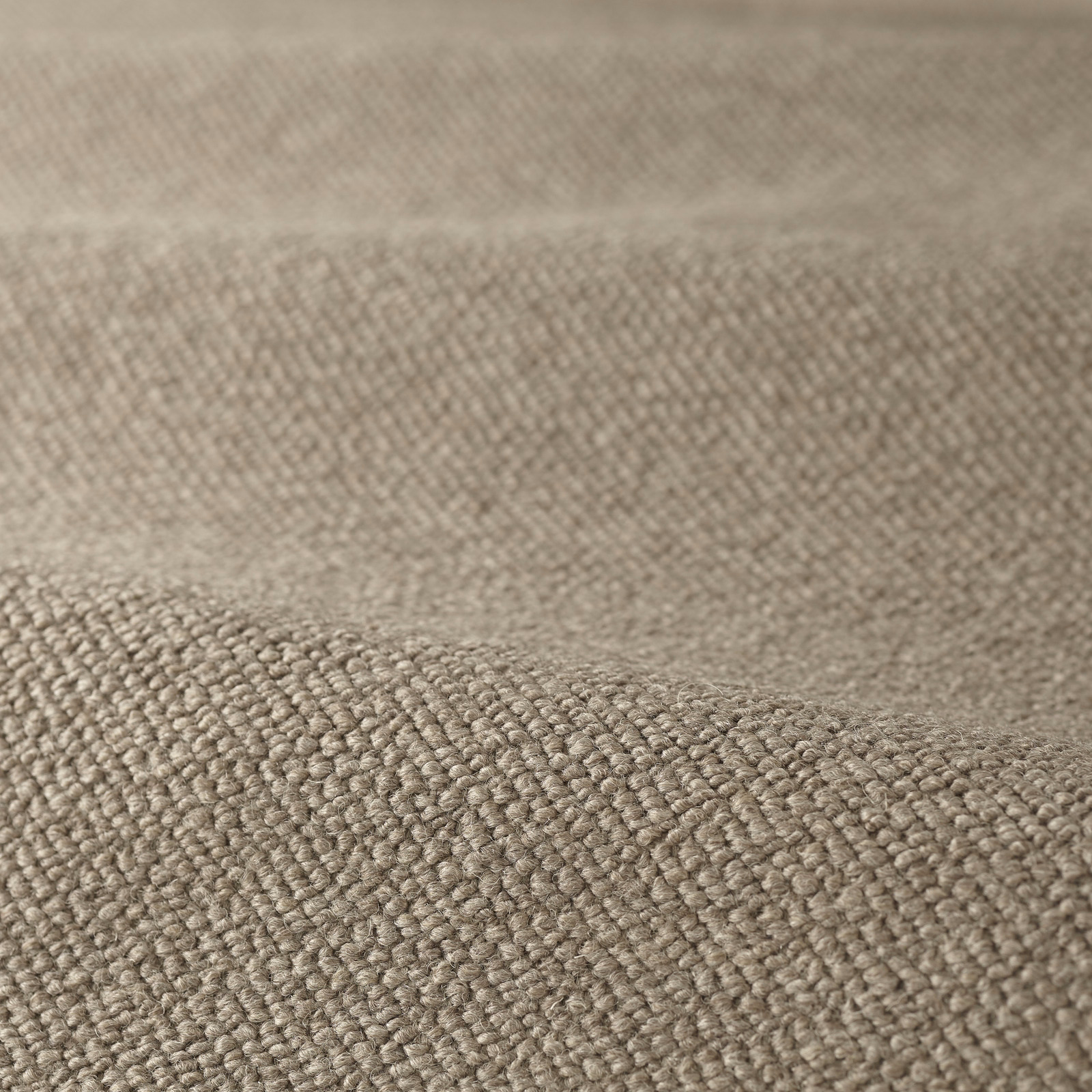 Warm taupe boucle with dense raised loops and softly mottled woven surface