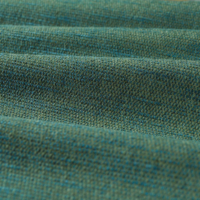 Close-up of deep moss chenille with teal and olive flecks in a tight weave