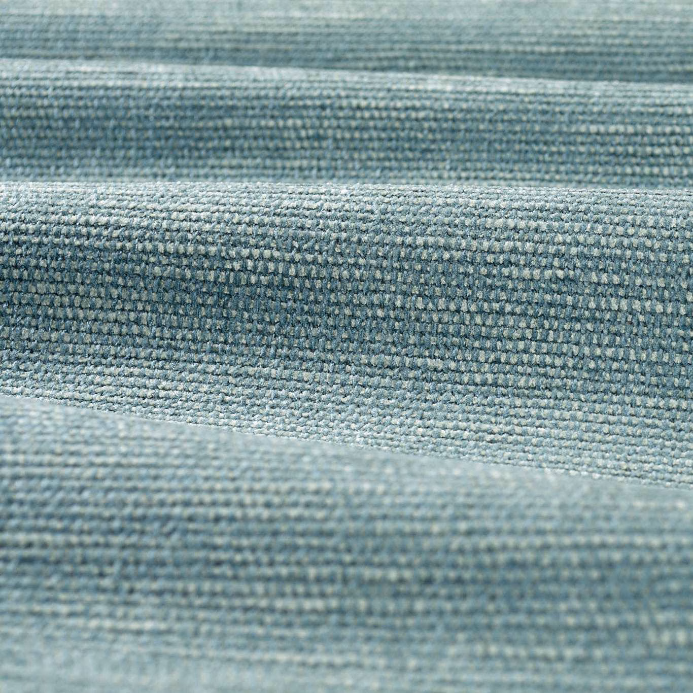 Close-up of muted blue-grey chenille with dense, ridged woven texture