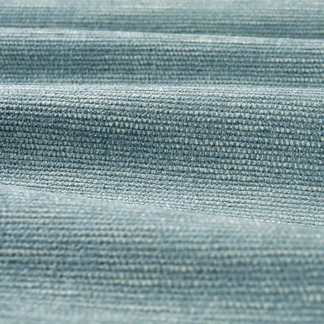 Close-up of muted blue-grey chenille with dense, ridged woven texture