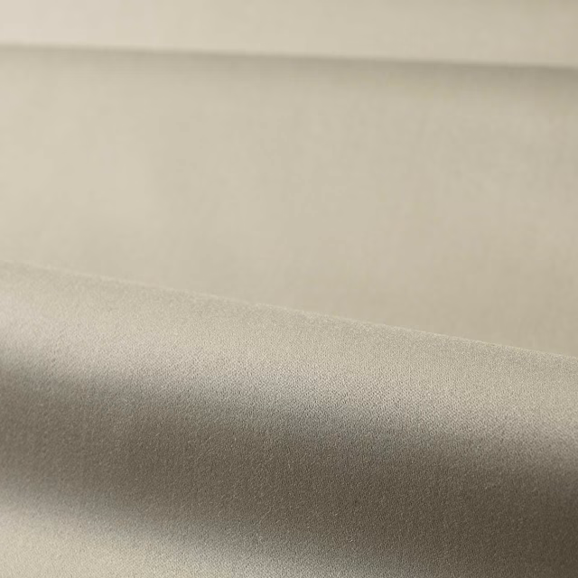 Soft greige plain satin fabric draped to show its smooth shaded surface