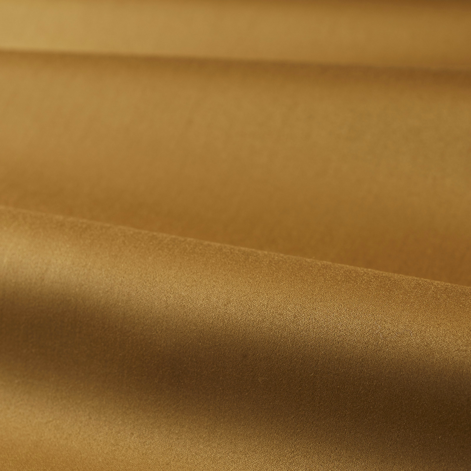 Warm muddy amber satin surface with bronze highlights and smooth directional sheen