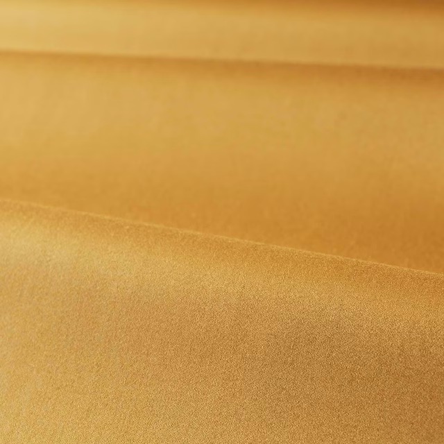 Warm old-gold satin surface with soft directional sheen and plain weave