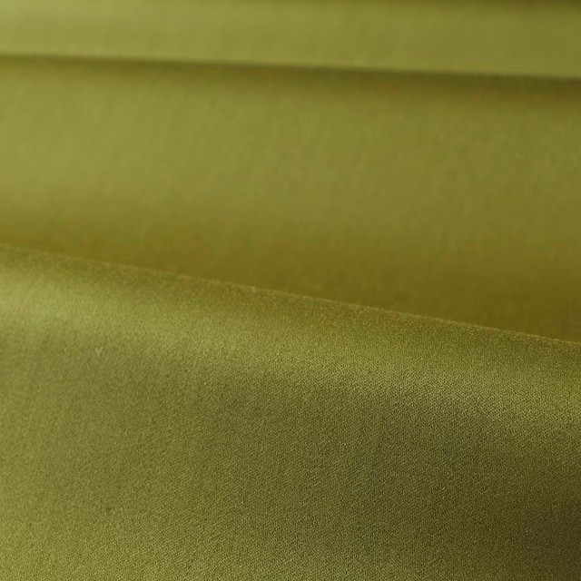 Muted olive green satin fabric folded to show smooth sheen and fine woven texture