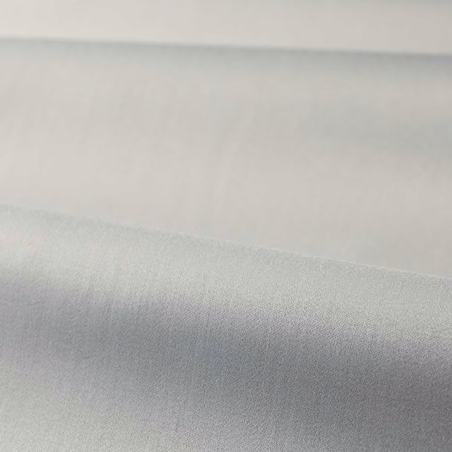 Cool platinum grey plain satin textile with a softly reflective surface