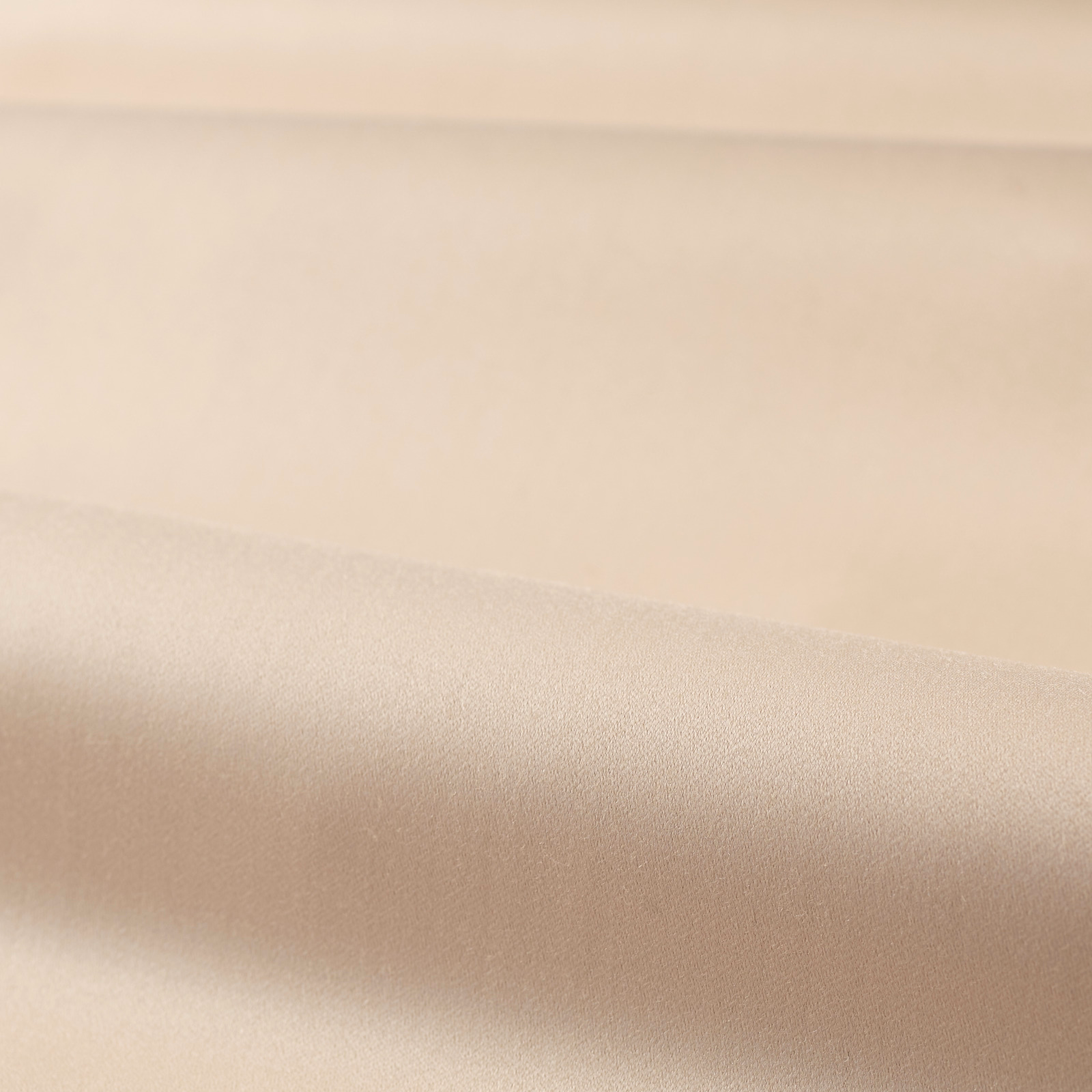 Folded plain Rose Quartz fabric showing a smooth blush-beige satin sheen