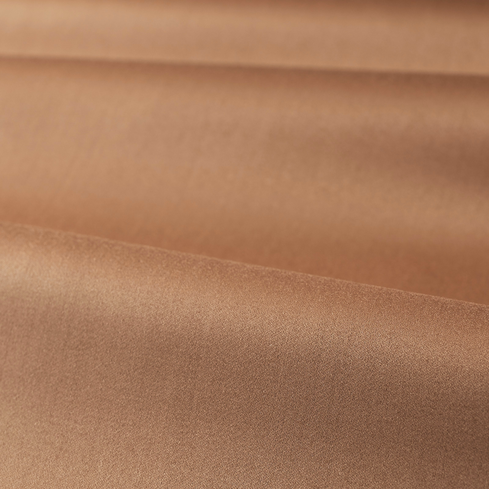Warm copper-taupe satin fabric folded to show smooth lustrous tonal shading