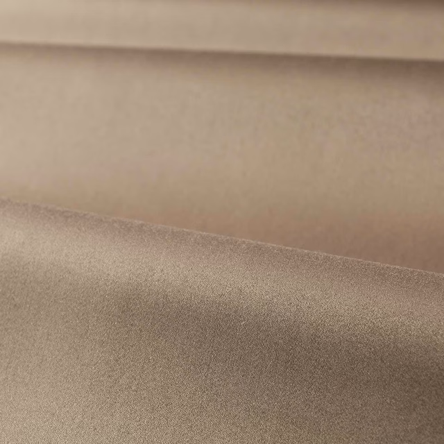 Muted taupe satin fabric with a smooth softly shimmering surface and folded swatch layers