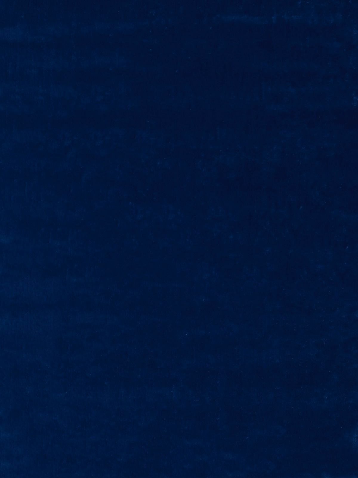 Deep lazuli blue textile with a dark, softly mottled plush surface