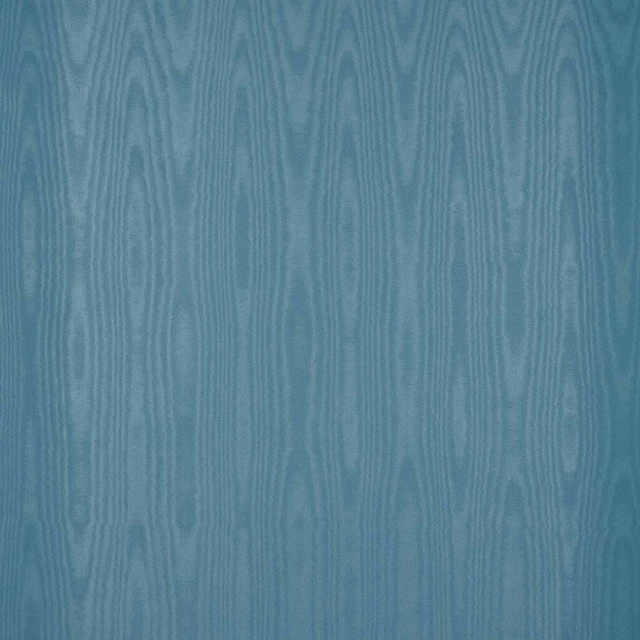 Muted blue moiré wallcovering with vertical ripples and subtle tonal sheen