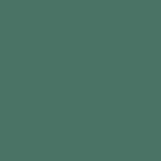 a flat tile of deep green-blue paint
