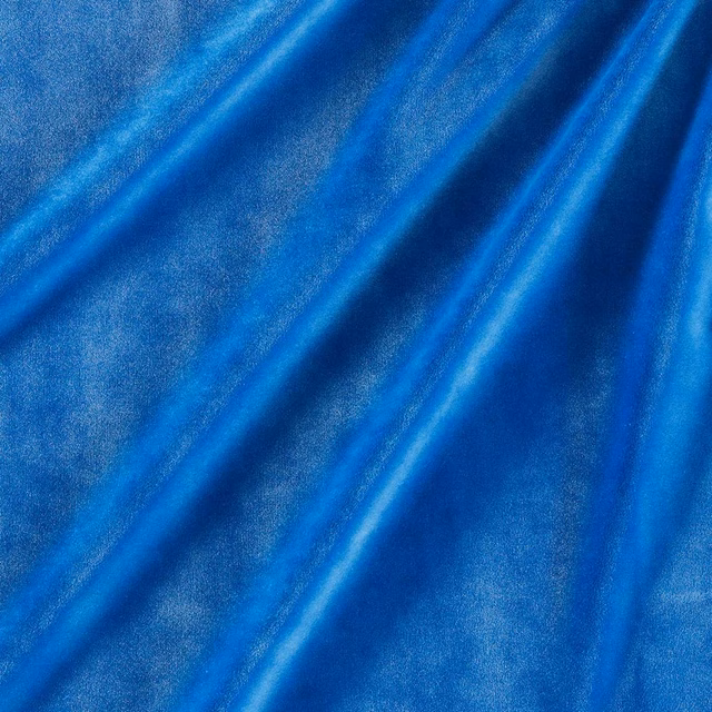 Cobalt blue velvet close-up showing directional sheen across softly folded pile