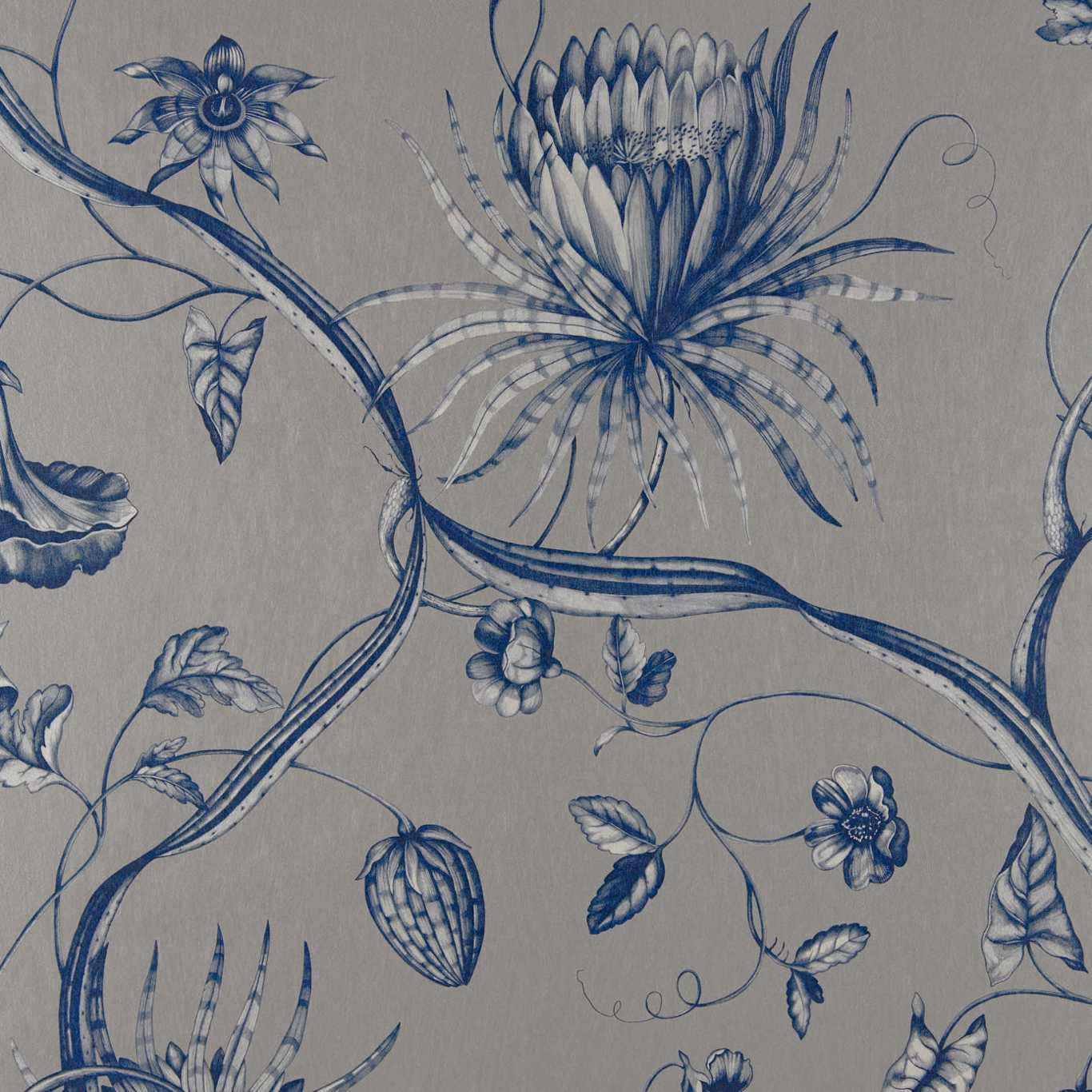 Prussian blue botanical flowers and curling stems on a warm grey textile ground