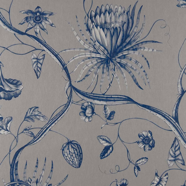 Prussian blue botanical flowers and curling stems on a warm grey textile ground