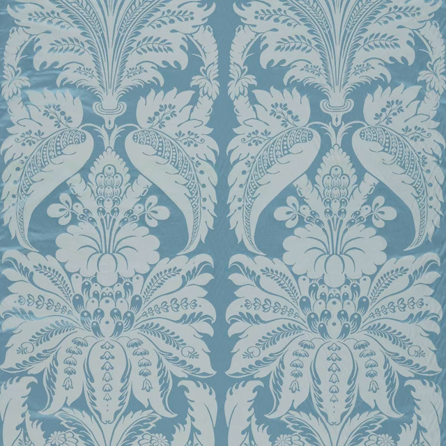 Muted Wedgwood blue fabric with pale symmetrical floral damask and scrolling foliage